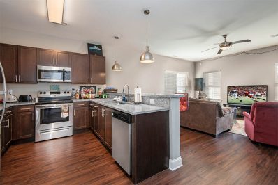 Open layout kitchen facing into a living room