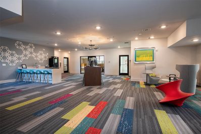 multi-colored carpeting in clubhouse