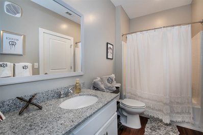 Bathroom with dark vanity