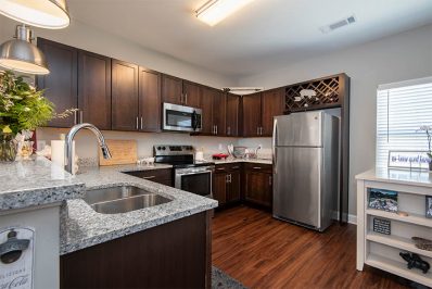 Open layout kitchen with stainless steel appliances