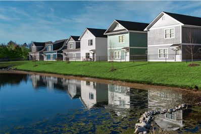 Exterior of the back of our cottages overlooking a body of water