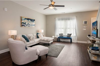 wood-style flooring in living room with furniture