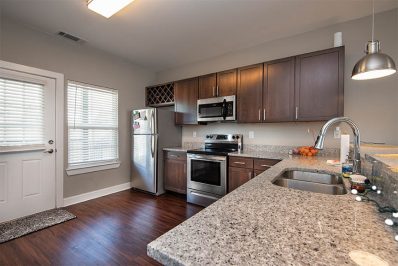 Open layout kitchen with stainless steel appliances