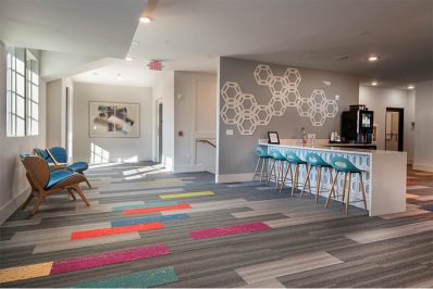 Countertop seating with multi-colored carpeting and grey walls