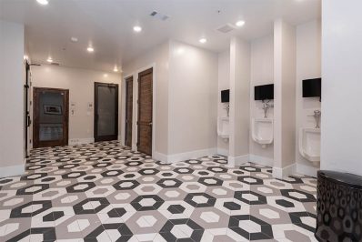 public bathroom with hexagonal flooring