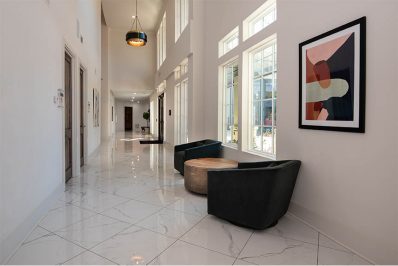 Table with two chairs in hallway