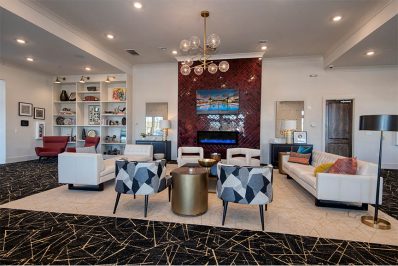 Lounge seating looking towards television and fire place