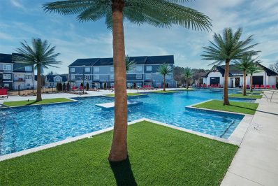 Greenery and trees surrounding the resort-style pool