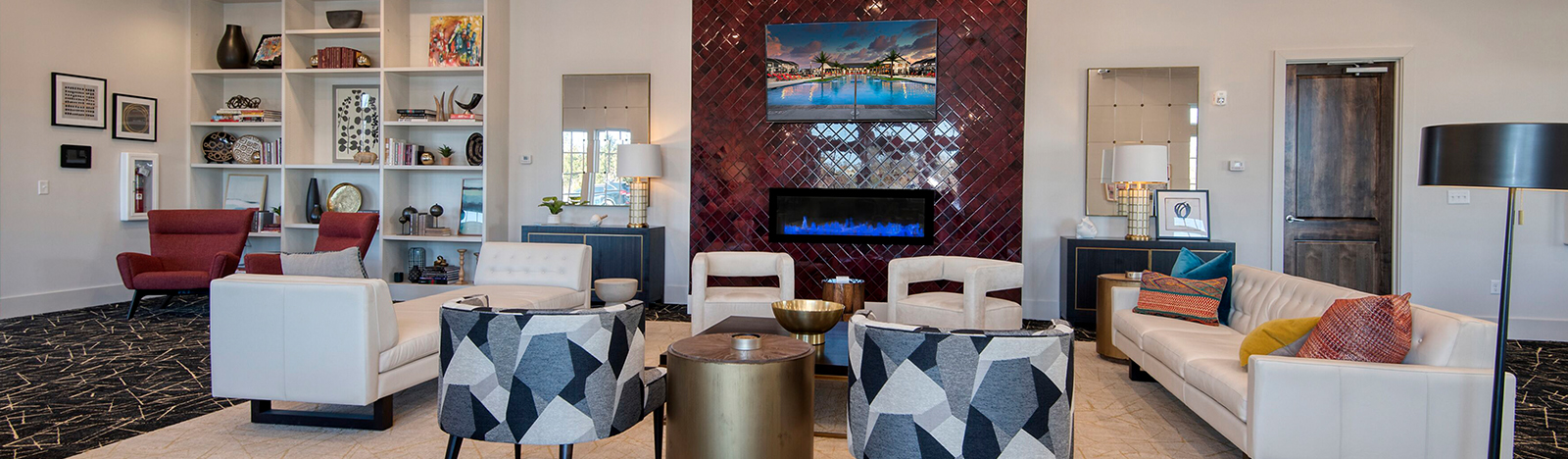 Clubhouse featuring lounge seating and a fire place